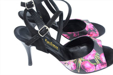 Black tango dancing shoes with two stripes.