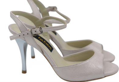 nude color dancing shoes for ladies with a leather sole and open heel cup.